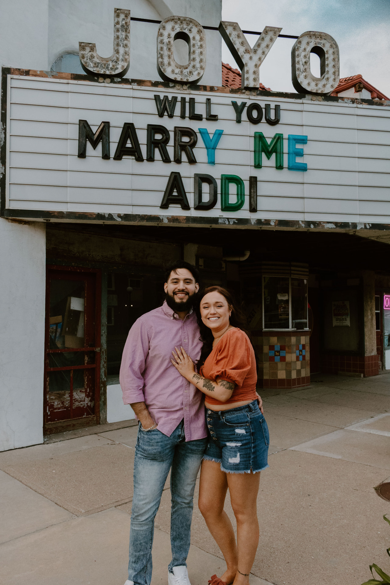 Addi and Geo together under the Joyo marquee after she said yes