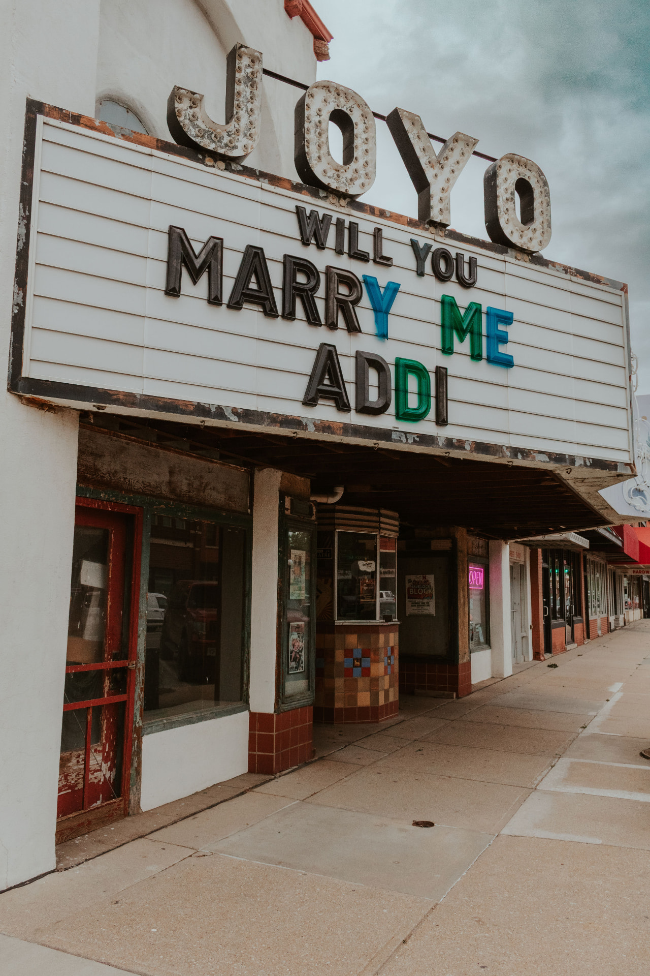 The Joyo Theater marquee reading “Will you marry me Addi”